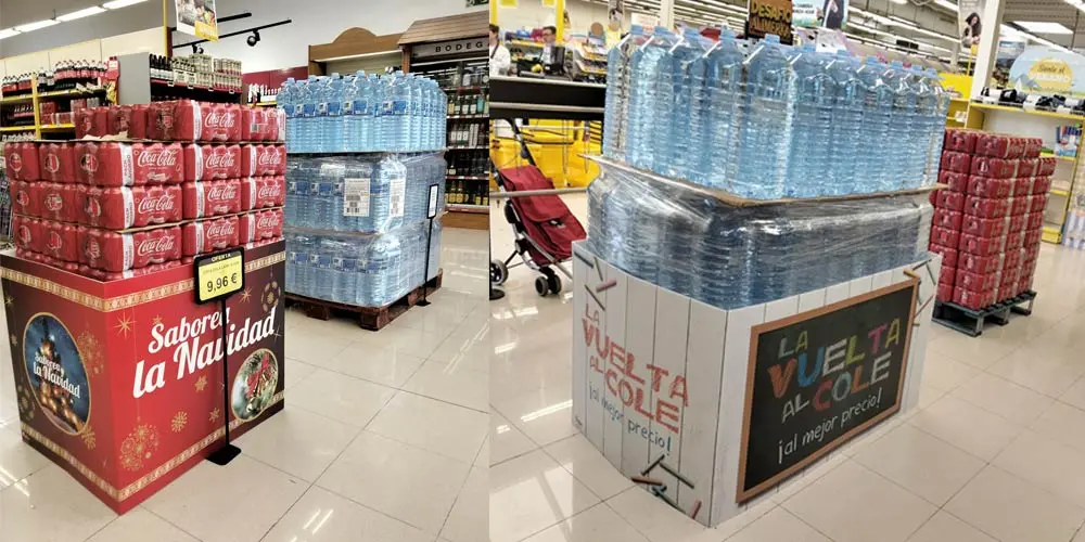 Isla promocional en supermercado revestida con cubrepalets personalizados y troquelados para campaña estacional.